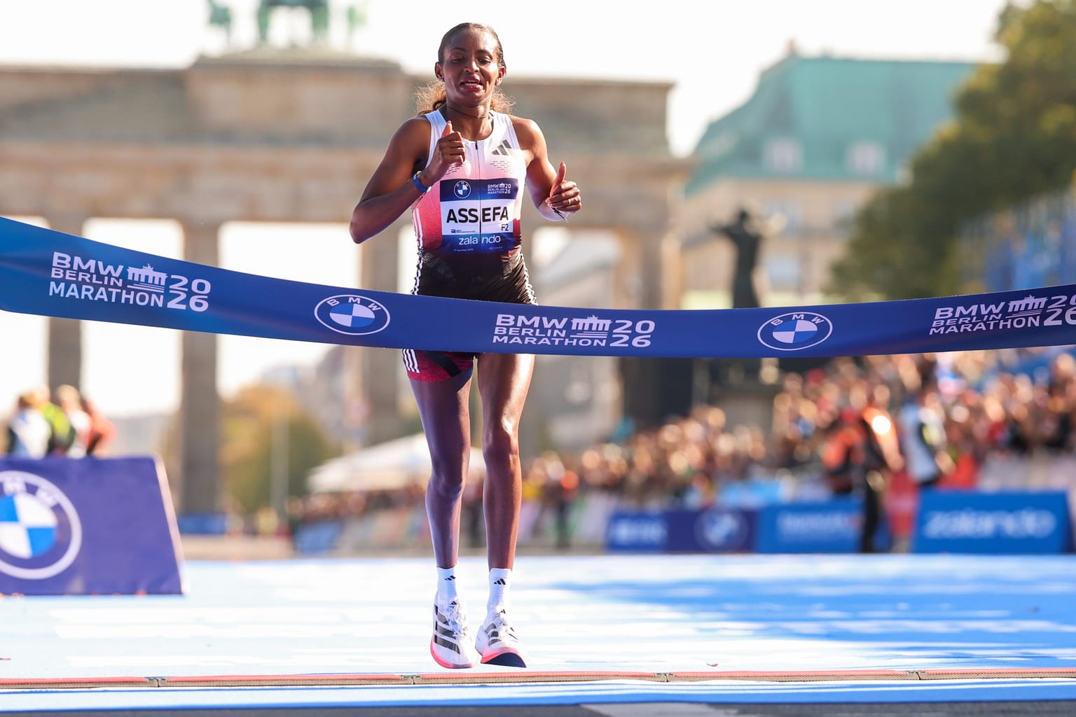 Assefa holds on for 2:11:04 as Adola regains Berlin crown:

Tigst Assefa came within sight of the world marathon record before late drama halted her challenge at the BMW Berlin Marathon